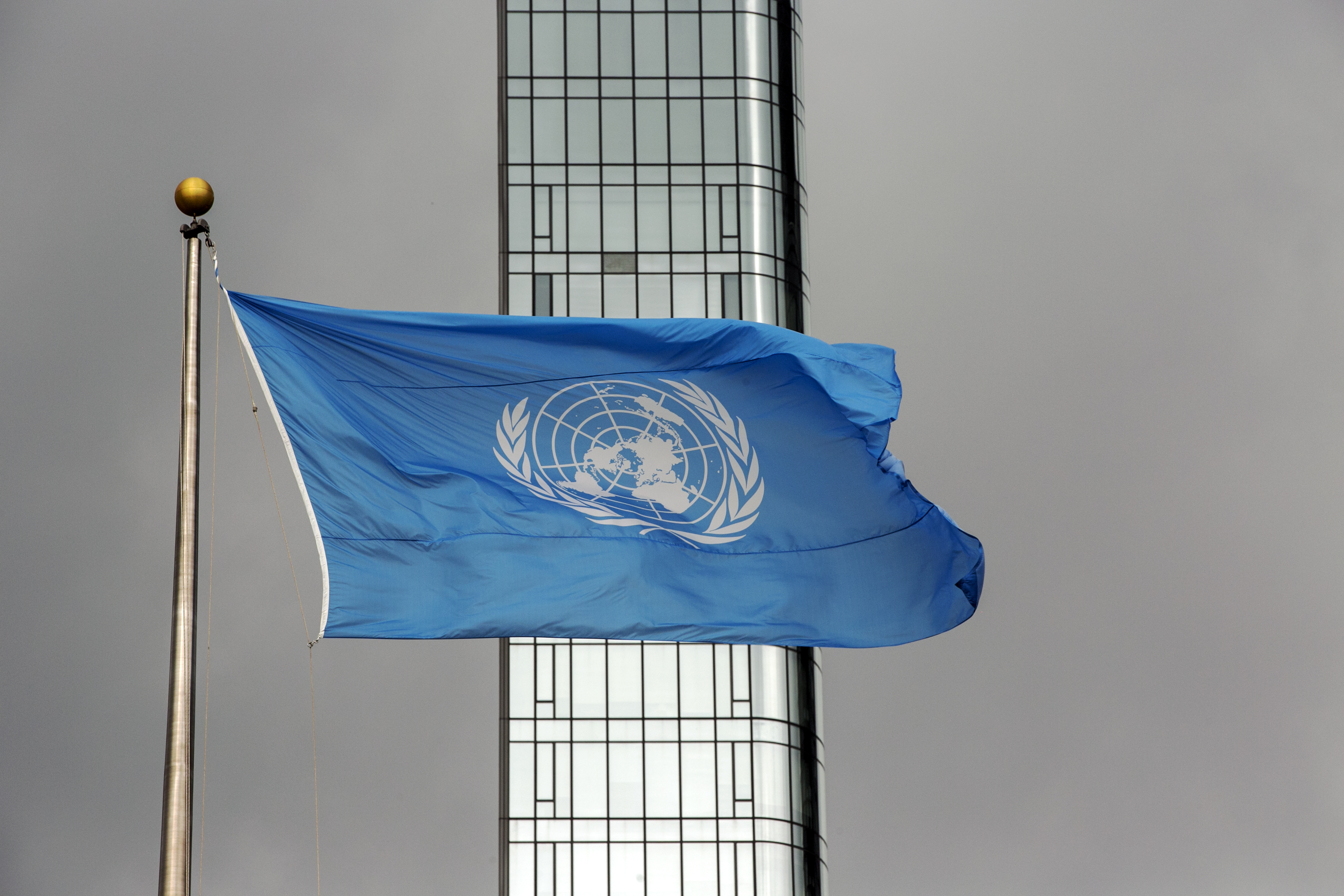 The UN flag flies on a stormy day at the United Nations during the United Nations General Assembly