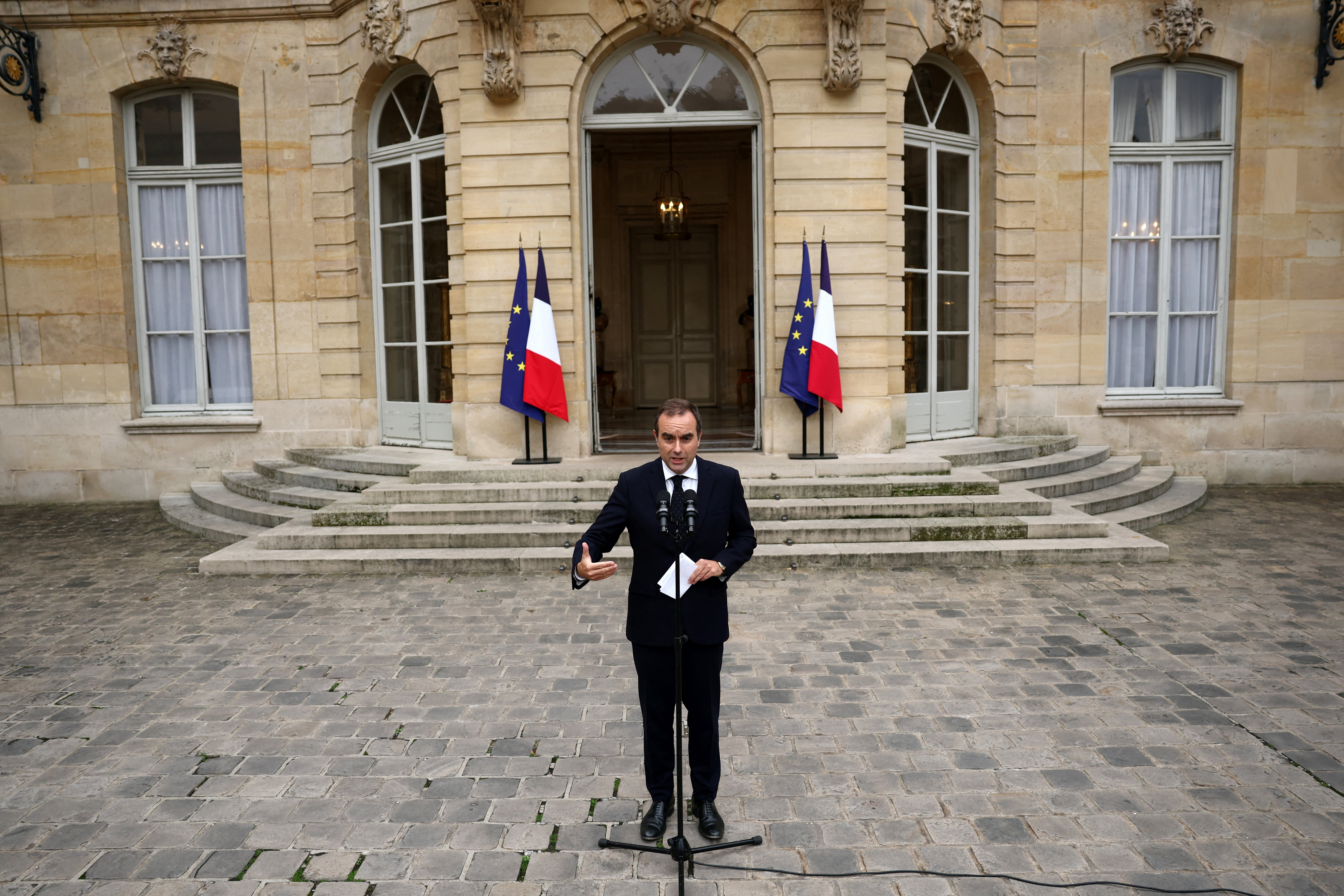 FILE - Then French Defense minister Sebastien Lecornu, right, and France's President Emmanuel Macron talk at the end of an address by the president to army leaders in Paris Sunday July 13, 2025, (Ludovic Marin, Pool via AP, File)
