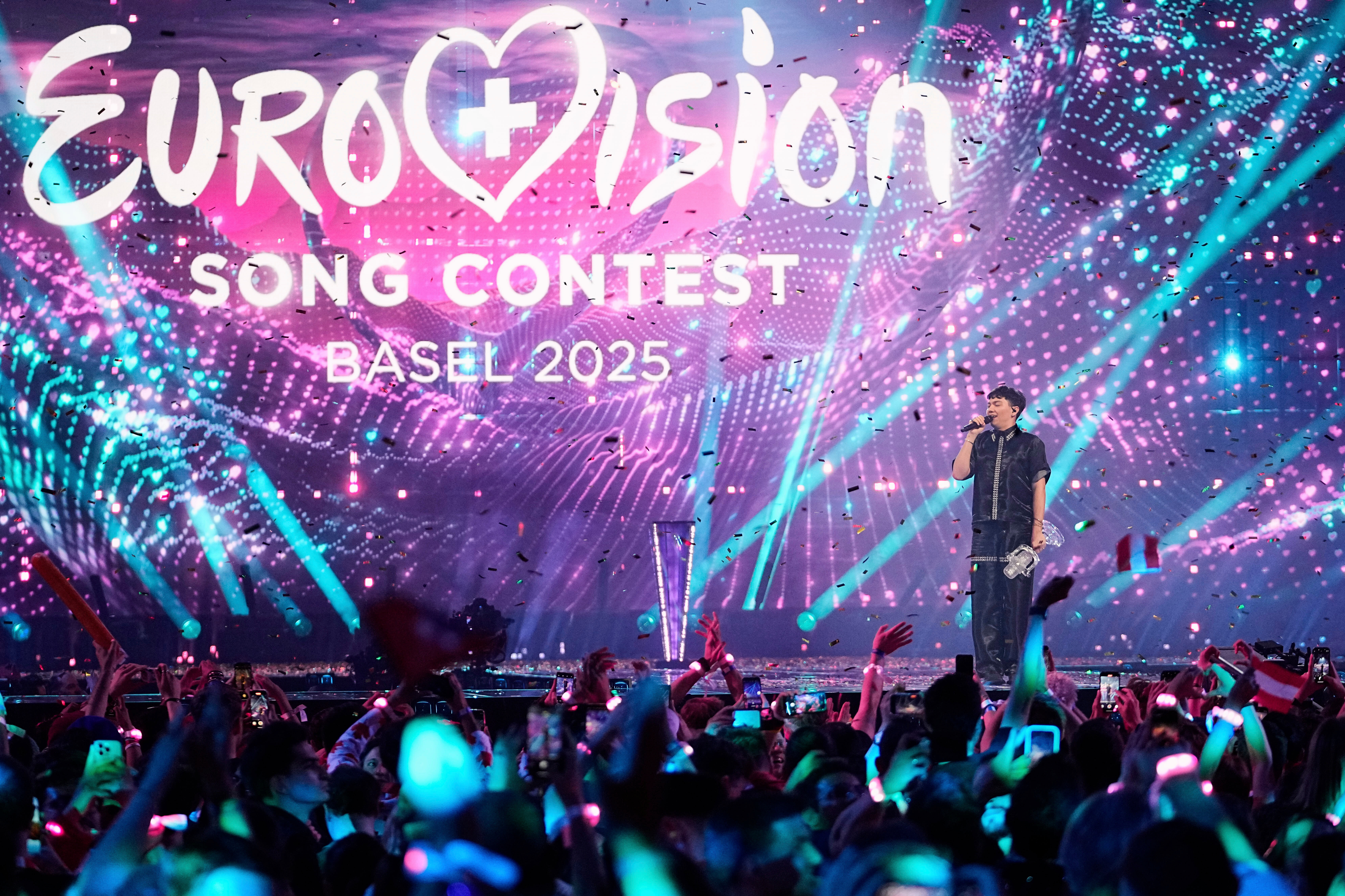 JJ from Austria stands on the stage with the trophy after winning the Grand Final of the 69th Eurovision Song Contest, in Basel