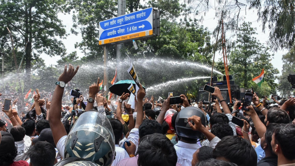 Indian police restrain hunger-striking activist on Independence Day