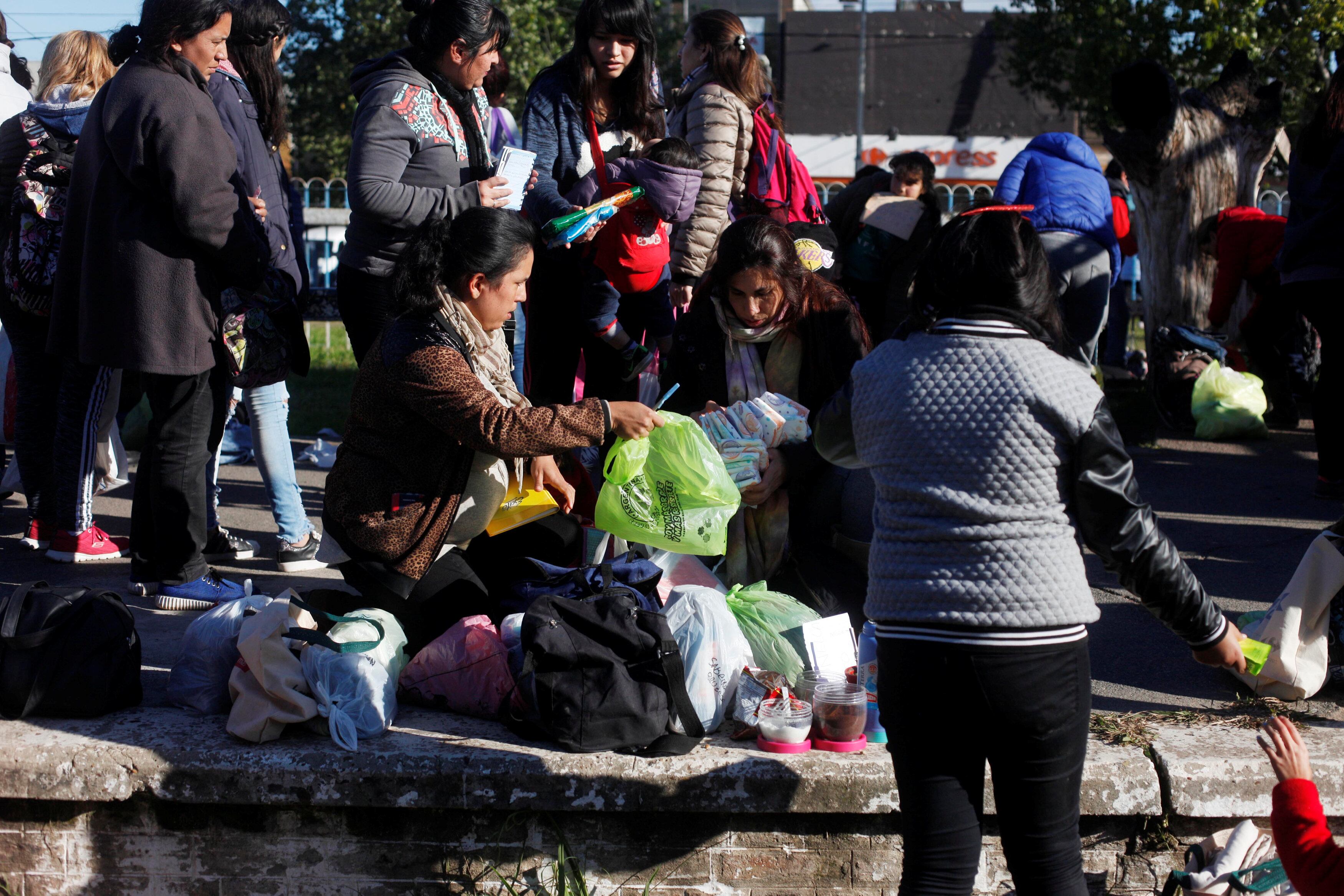 People barter goods in San Miguel market, on the outskirts of Buenos Aires, Argentina. (REUTERS)