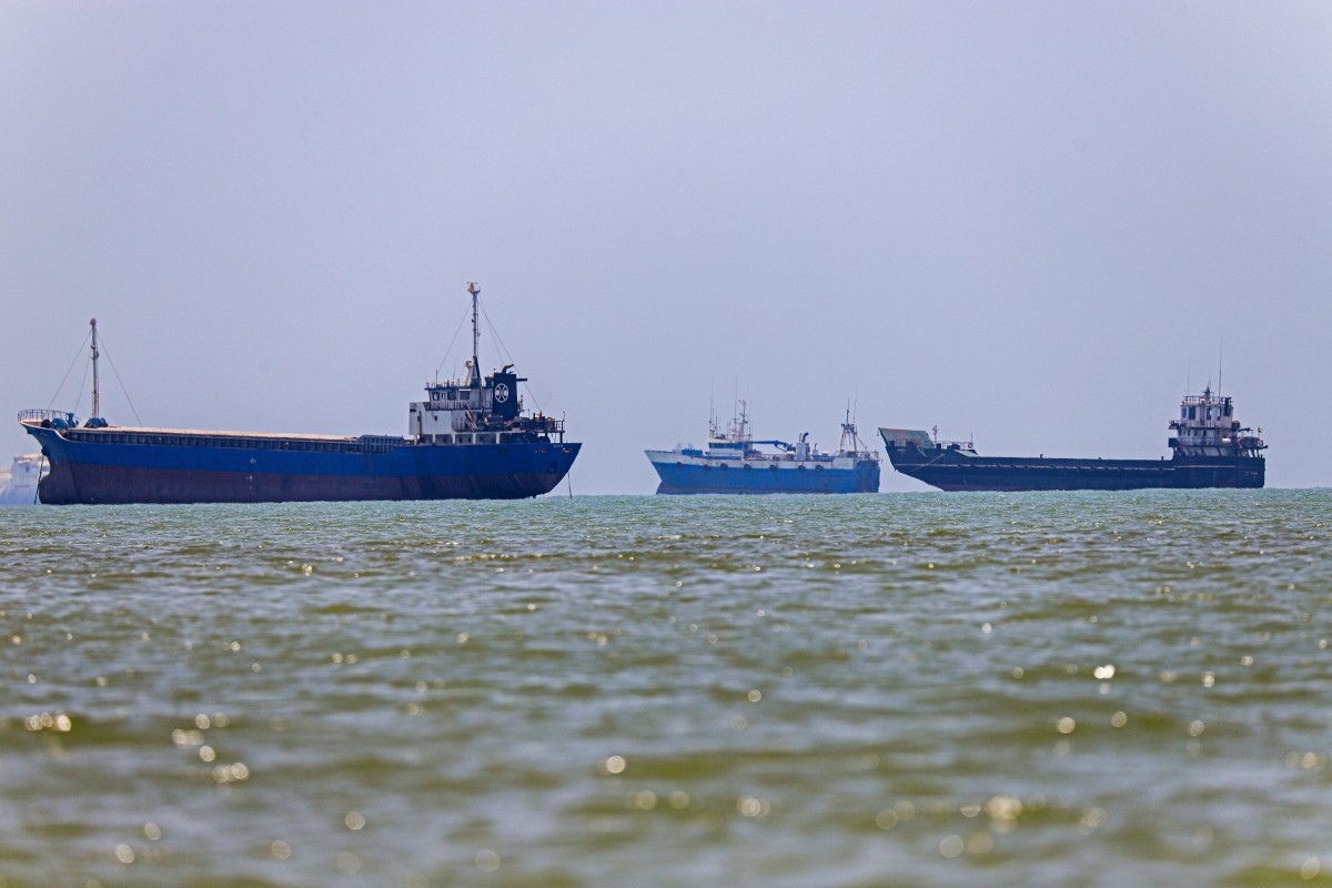 Ships begin moving through Strait of Hormuz as oil markets fluctuate