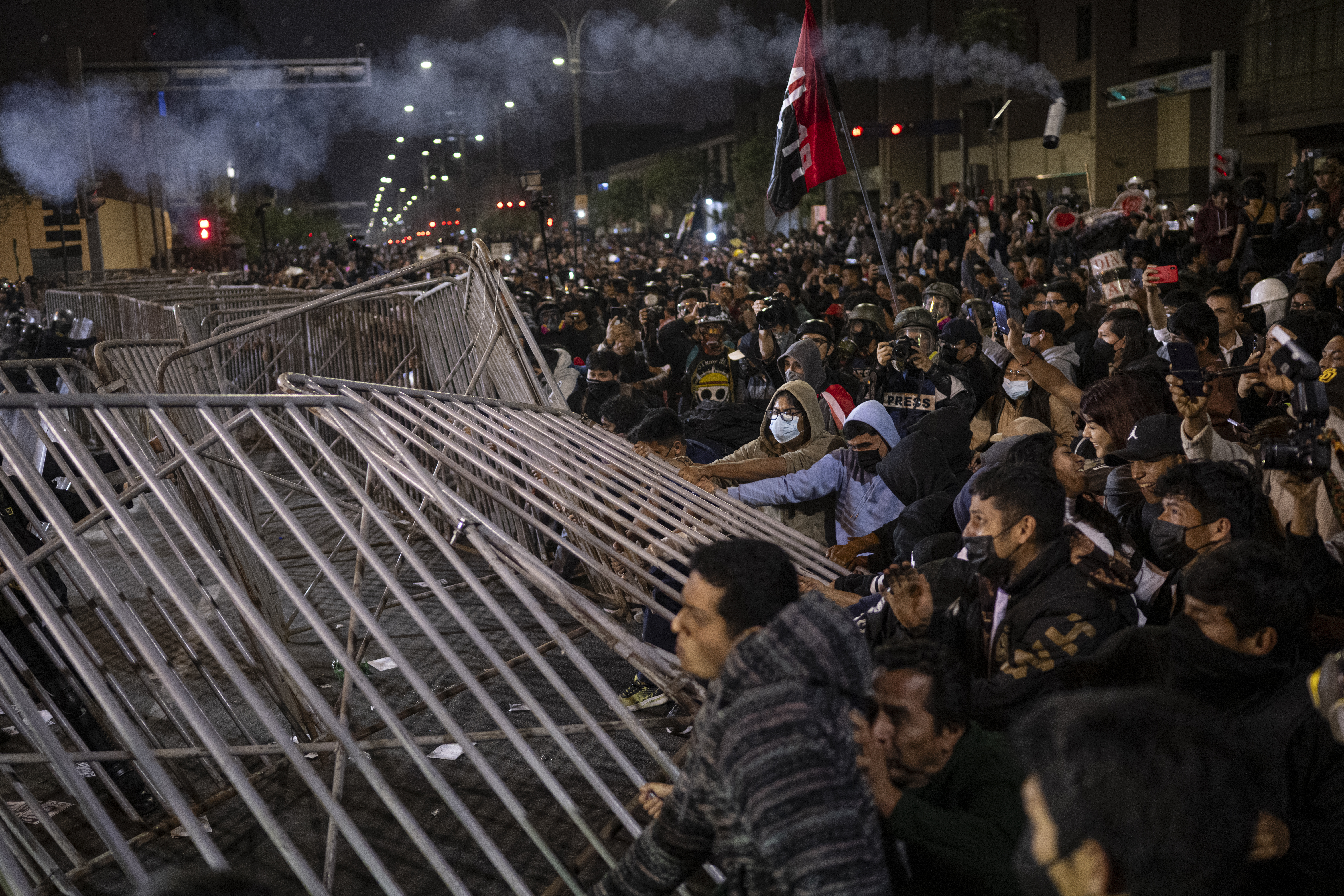Demonstrators clash with riot police during an anti-government demonstration in Lima on September 27, 2025. 