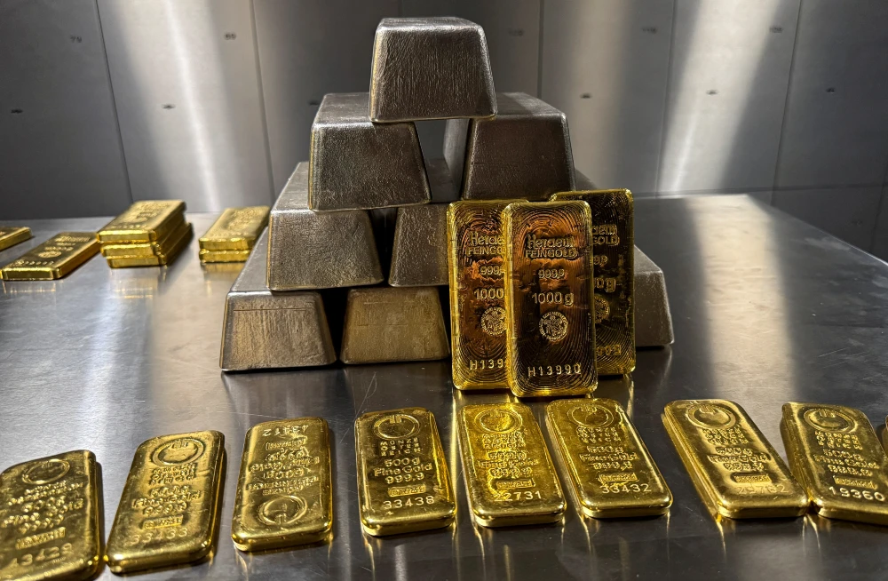 Gold hits record high on safe-haven rush; silver follows suit