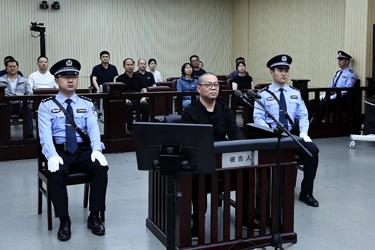 This photo released by the Tianjin No.2 Intermediate People’s Court on May 28, 2024 shows Bai Tianhui (C), the former general manager of China Huarong International Holdings (CHIH), during his sentencing at the court on May 28, 2024. (TIANJIN NO.2 INTERME