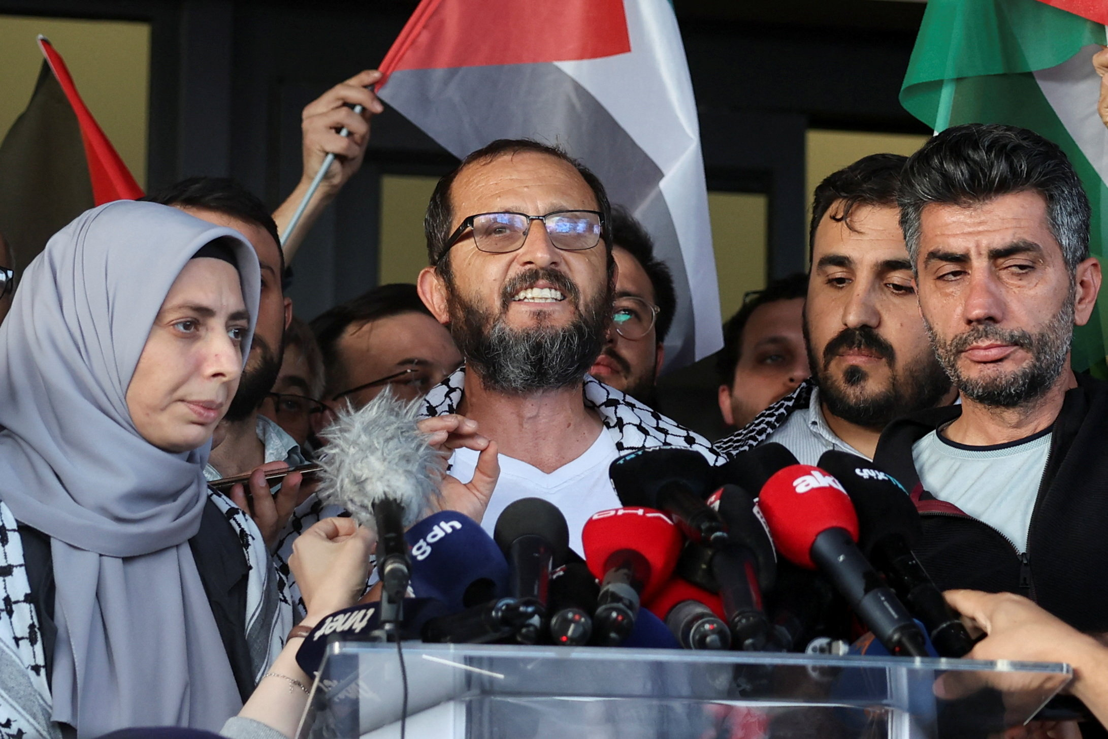 Halil Rifat Canakci of Turkey, one of the activists who were sailing aboard vessels from the Global Sumud Flotilla which were seized by Israeli forces, reacts after arriving at Istanbul Airport on a special flight, in Istanbul, Turkey, October 4, 2025. RE