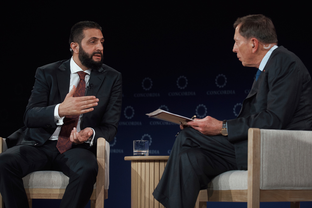 Syrian President Ahmed al-Sharaa, former US Army General David Howell Petraeus