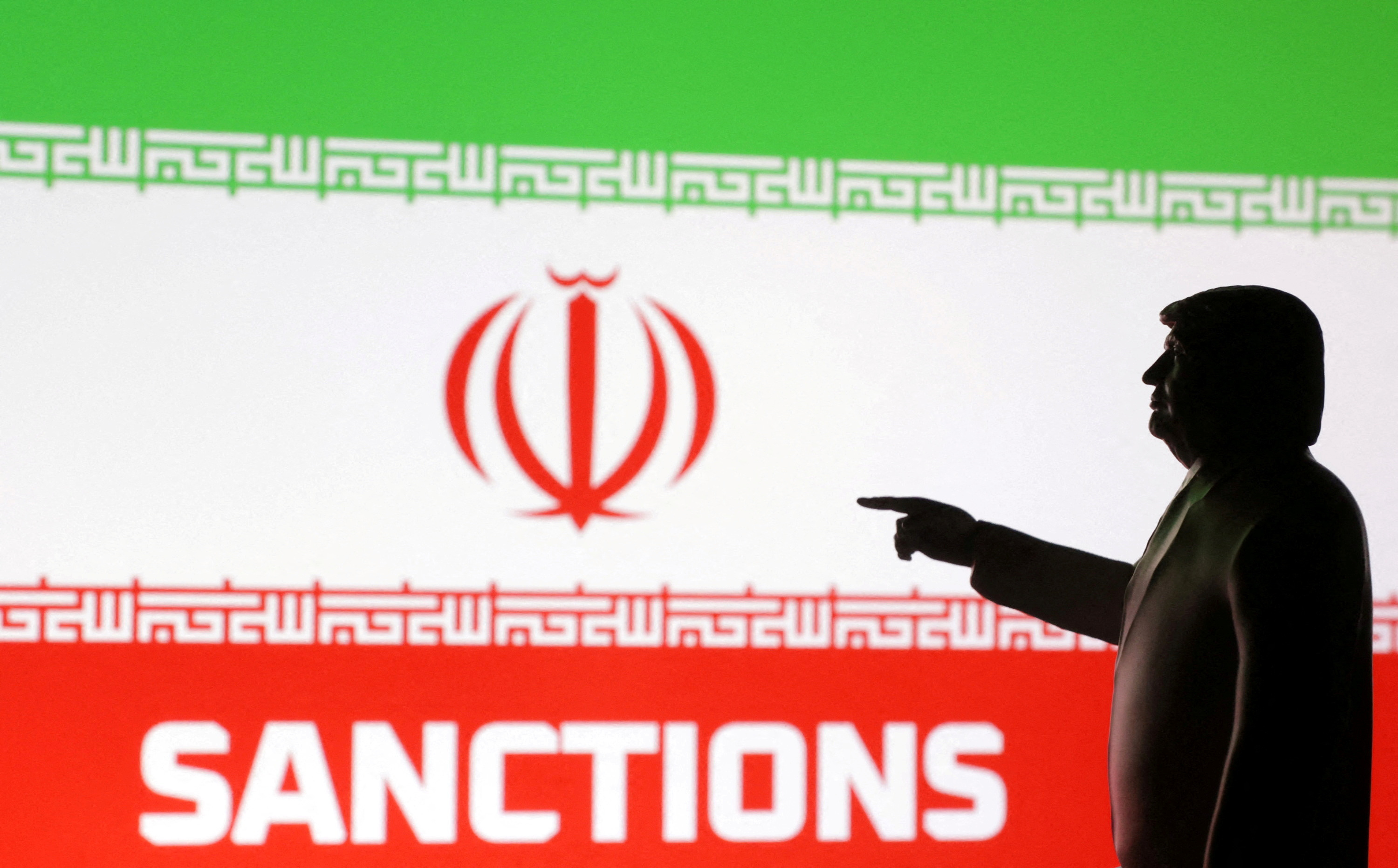 A 3D-printed miniature model depicting US President Donald Trump, Iran flag and word "Sanctions" in this illustration taken, April 17, 2025. (Reuters)