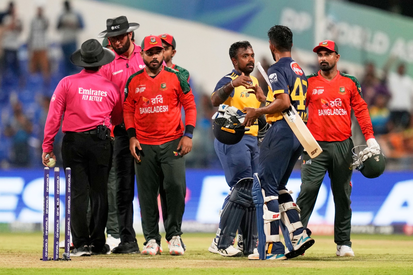 Charith Asalanka, third right, and teammate Kamil Mishara celebrate 