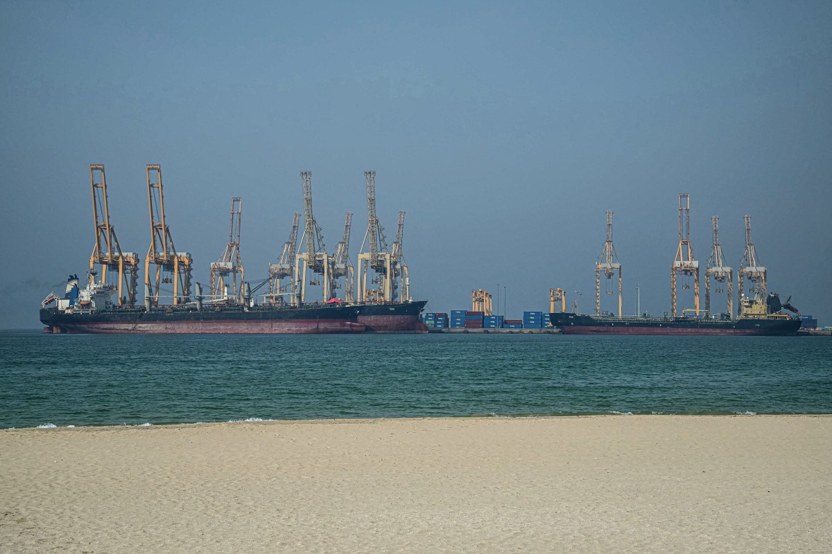 Tankers are seen at the Khor Fakkan Container Terminal, the only natural deep-sea port in the region and one of the major container ports in the Sharjah Emirate, along the Strait of Hormuz. (AFP)
