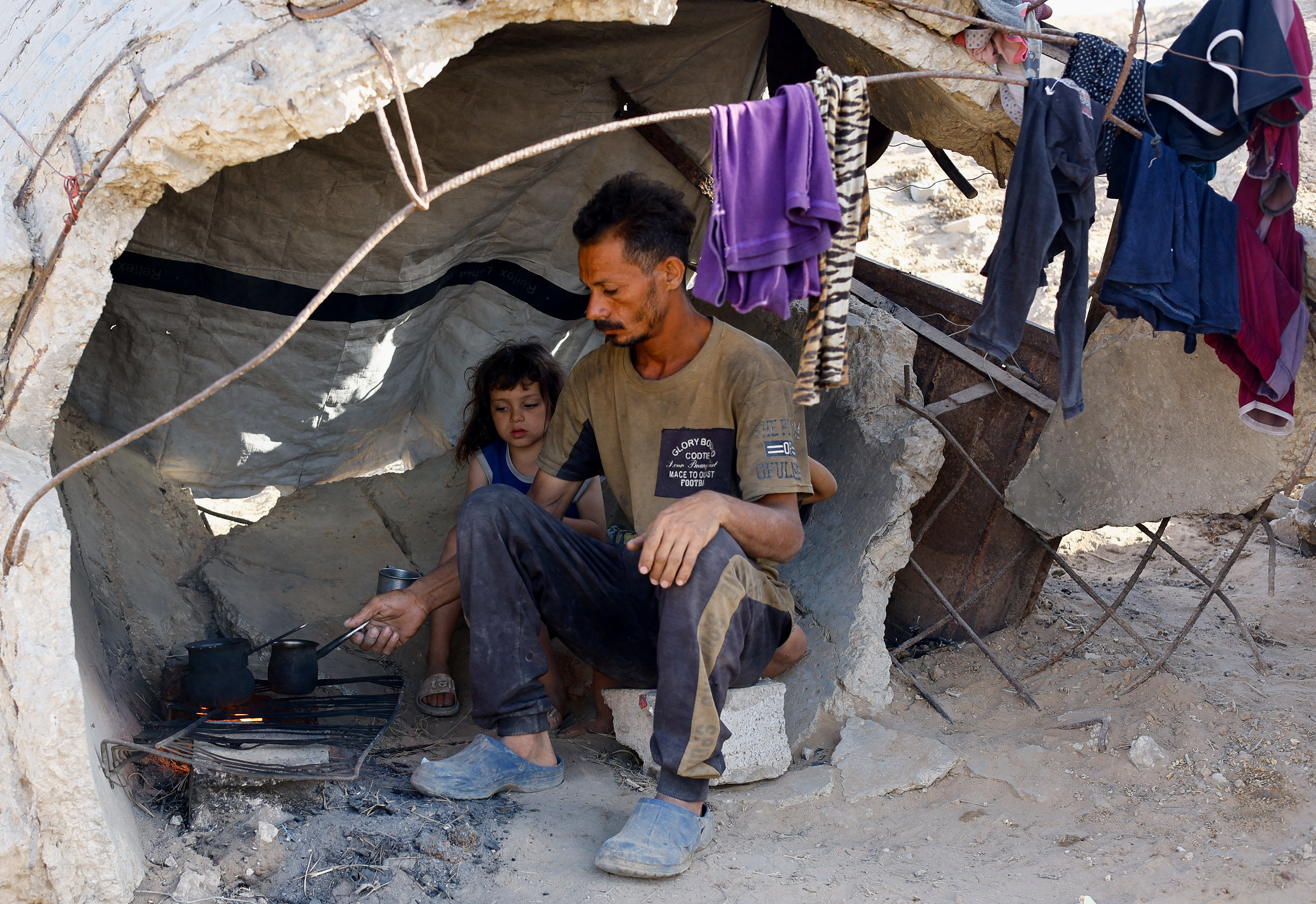 Palestinians, displaced from northern Gaza due to an Israeli military operation, take shelter, after evacuating southwards, following Israeli forces' orders to leave Gaza City, in the central Gaza Strip, October 3, 2025. (Reuters)