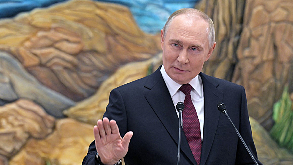 In this pool photograph distributed by the Russian state agency Sputnik, Russia's President Vladimir Putin meets with the Russian media in Bishkek on November 27, 2025. (AFP