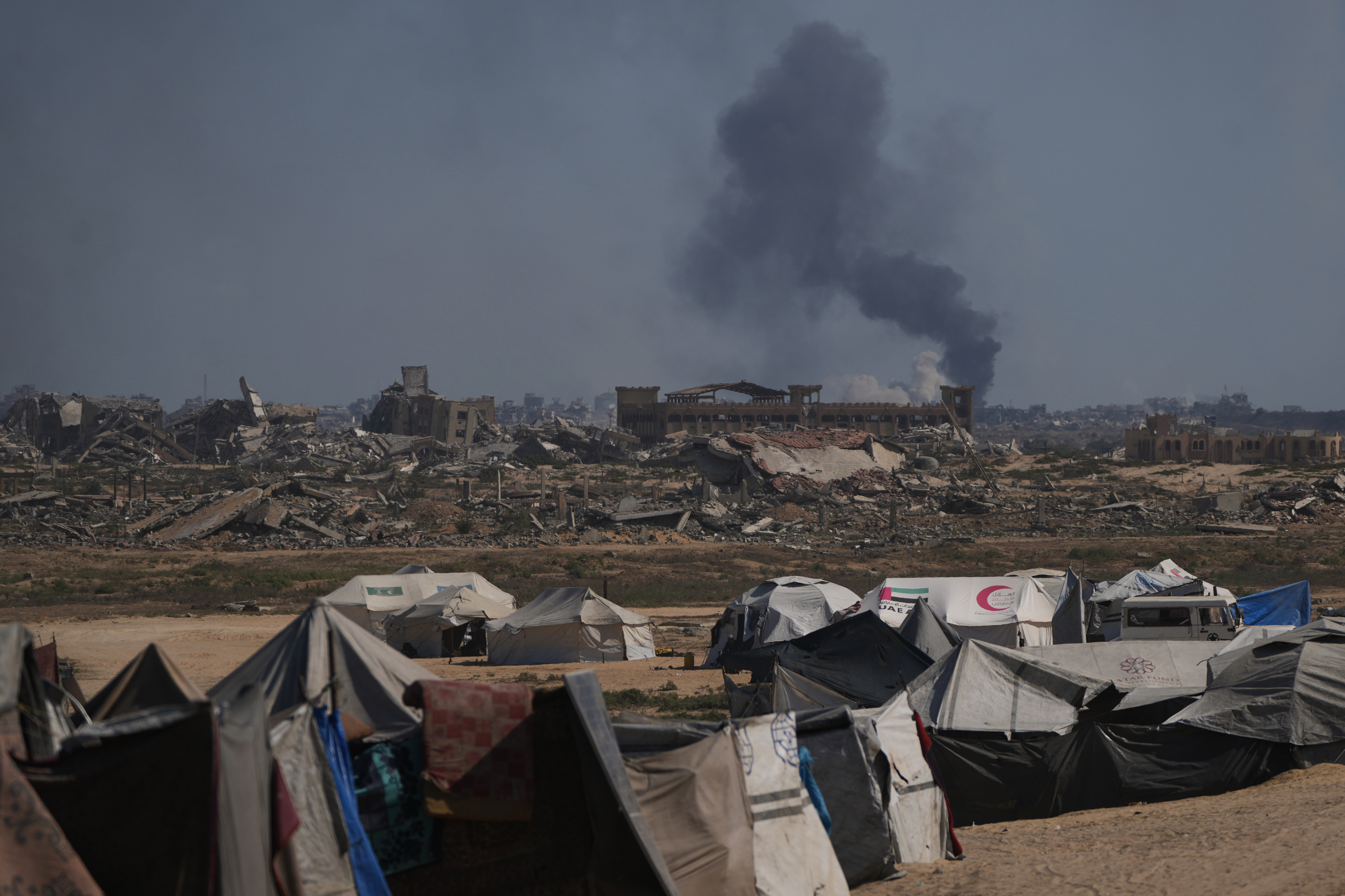 Smoke rises to the sky following an Israeli military strike in Gaza City, as seen from the central Gaza Strip, Thursday, Oct. 2, 2025. (AP Photo/Abdel Kareem Hana)