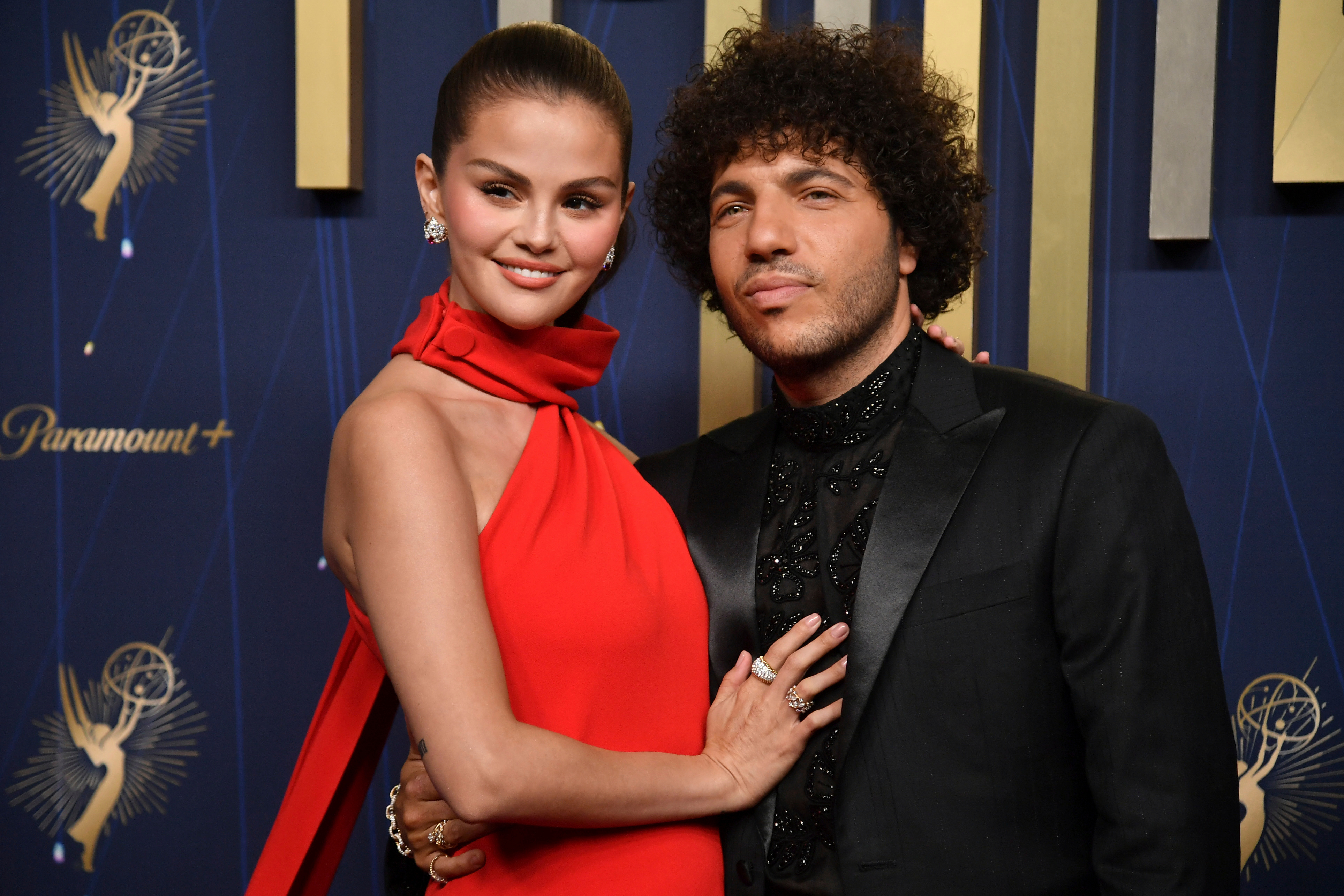 Selena Gomez, left, and Benny Blanco arrive at the 77th Primetime Emmy Awards on Sunday