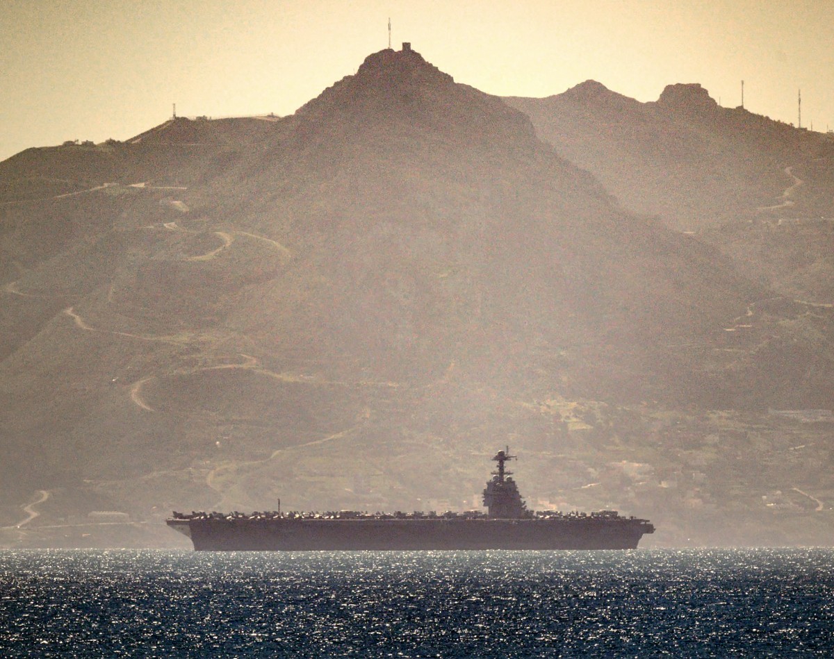 This handout image released and taken by David Parody on February 20, 2026, shows the US aircraft carrier USS Gerald Ford heading through the Strait of Gibraltar as seen from Gibraltar. (AFP)