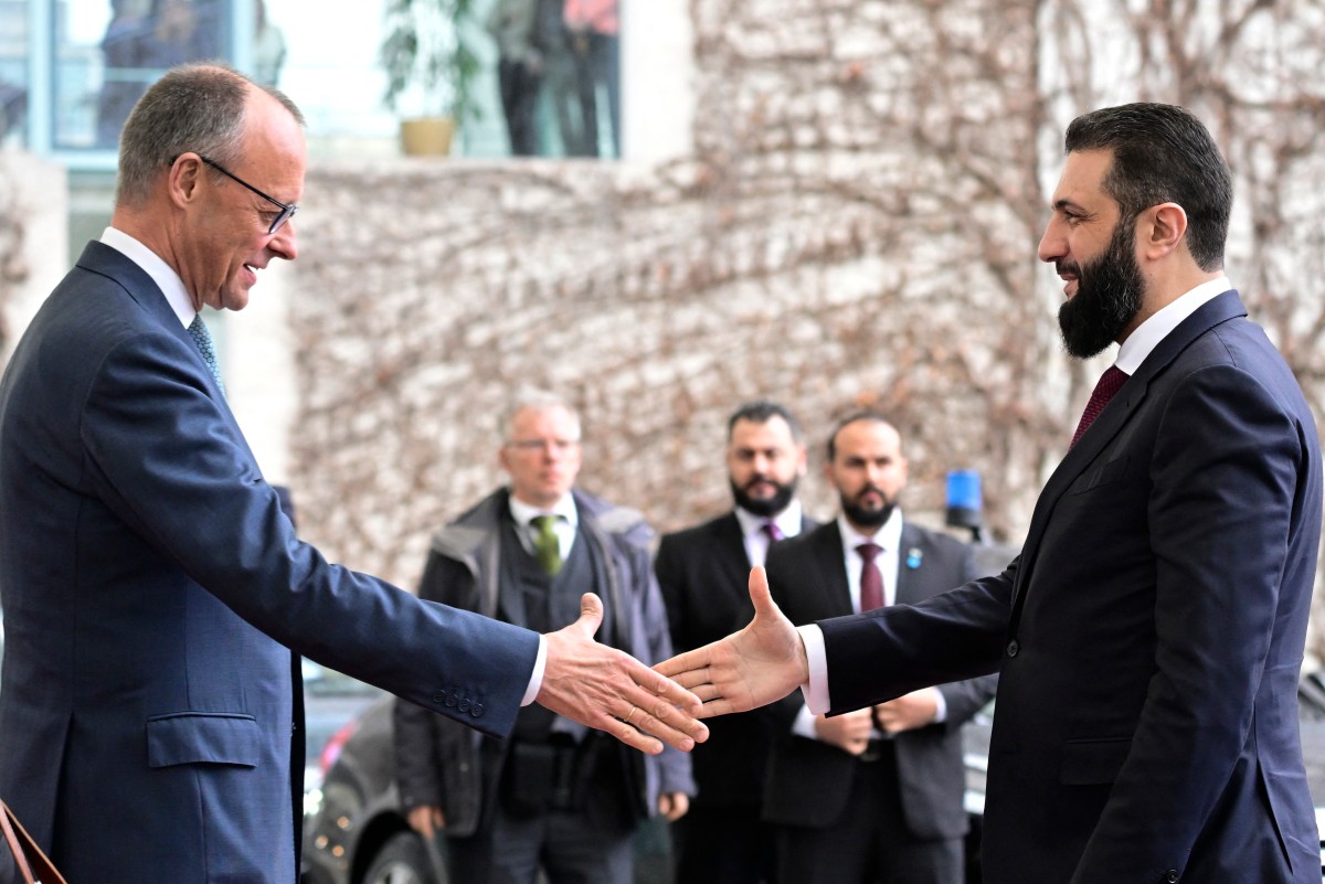 German Chancellor Friedrich Merz (L) welcomes Syrian President Ahmed al-Sharaa at the Chancellery in Berlin on March 30, 2026. (AFP)